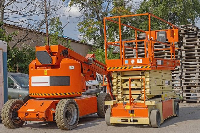 heavy-duty forklift maneuvering through a busy warehouse in Bernalillo